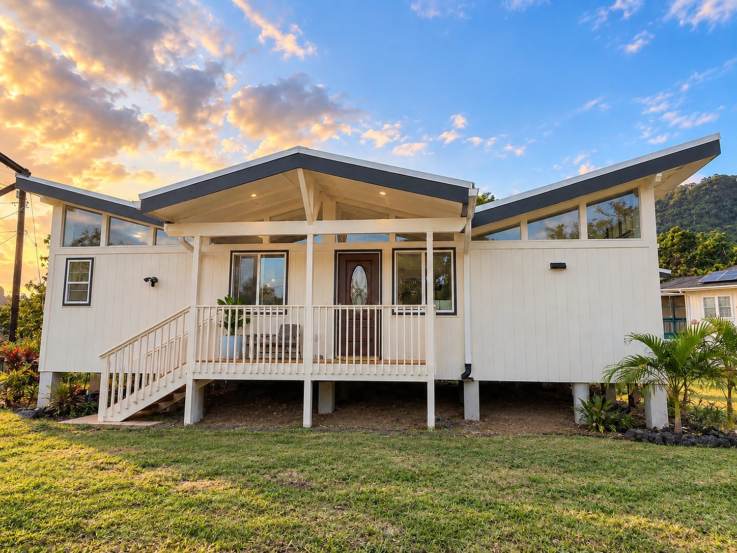 Finished custom home in Kapa‘a at sunset, seen from the lanai side